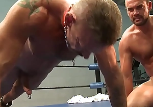 Hunky guy makes his boyfriend finish pushups in the ring