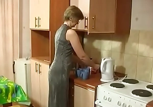 Young boy takes tea with mature - motheryes com